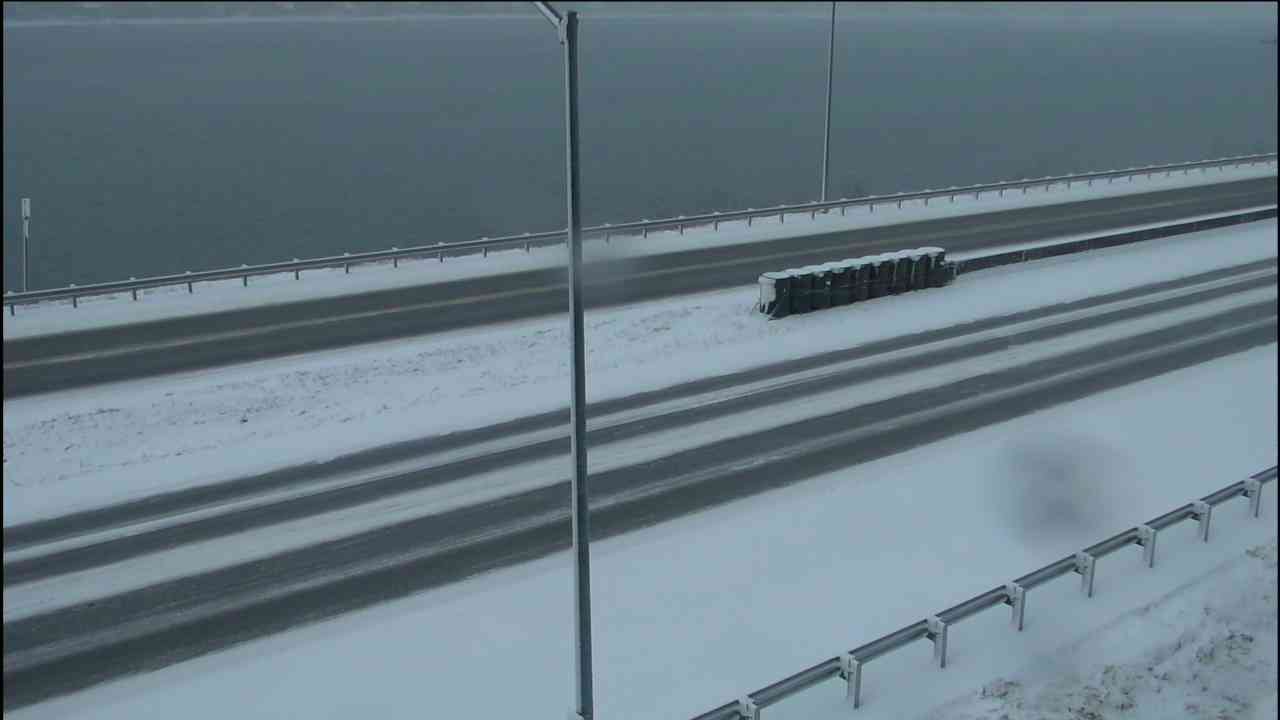 Sidewinder view of a snow-covered bridge deck through the hydrophilic window, before rain